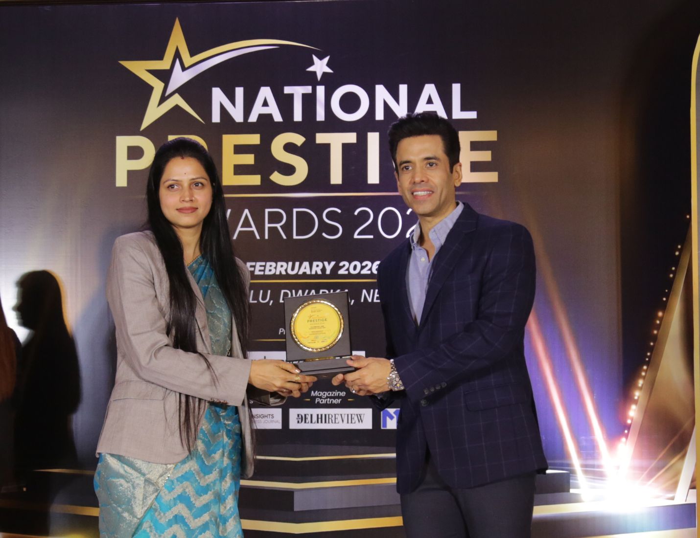 Dr. Ritu Choudhary receiving medical excellence award